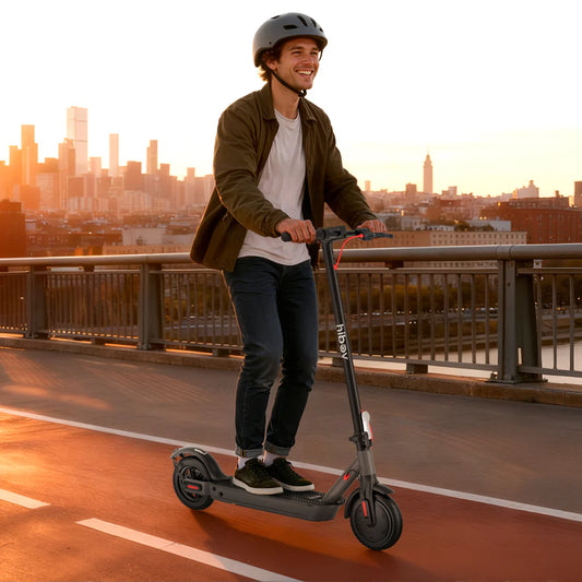 Man riding an electric scooter on a bridge with a city skyline in the background