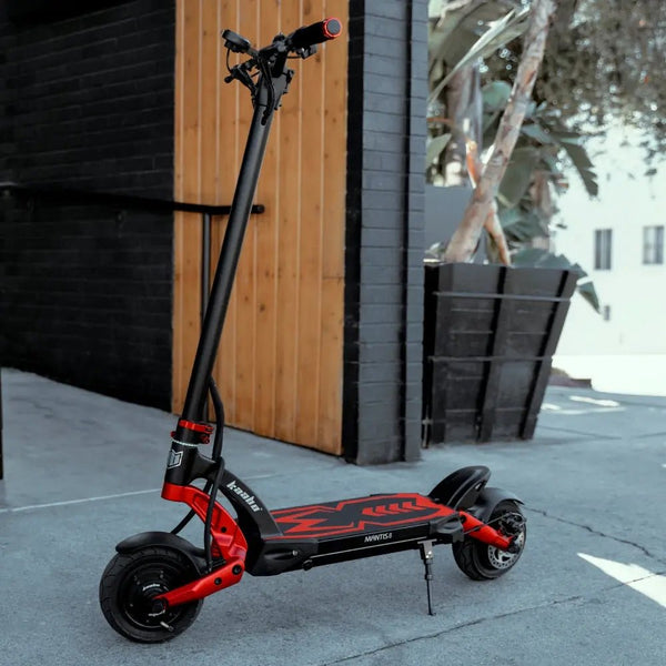 Kaabo Mantis 8 Lite electric scooter parked by a wooden wall