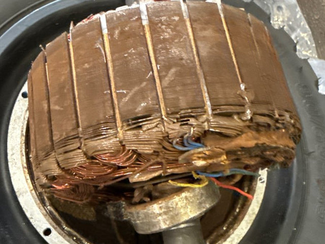 Electric scooter hub motor opened up for repair at a Wilson's shop
