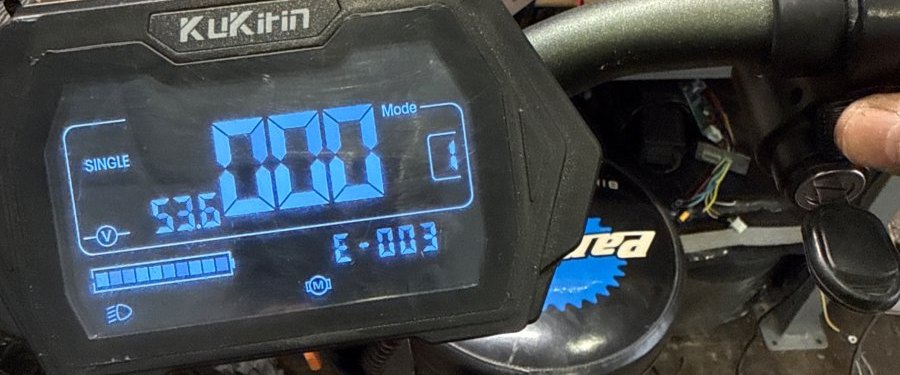 KuKirin electric scooter display showing error code E-003 at Wilson's Long Island City shop