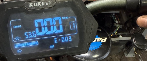 KuKirin electric scooter display showing error code E-003 at Wilson's Long Island City shop
