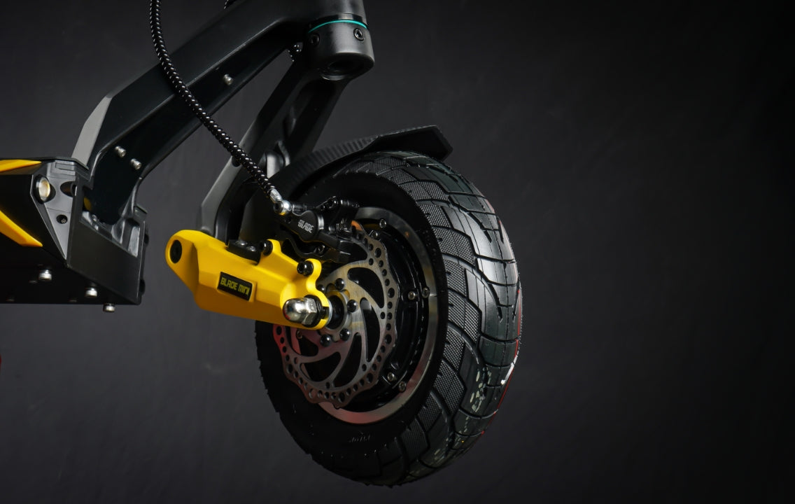 Teverun Blade Mini electric scooter with dual 3300W motors, 60V battery, hydraulic brakes, dual suspension, and IPX6 water resistance.
