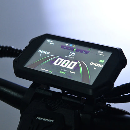 Digital display on a motorcycle with a dark background