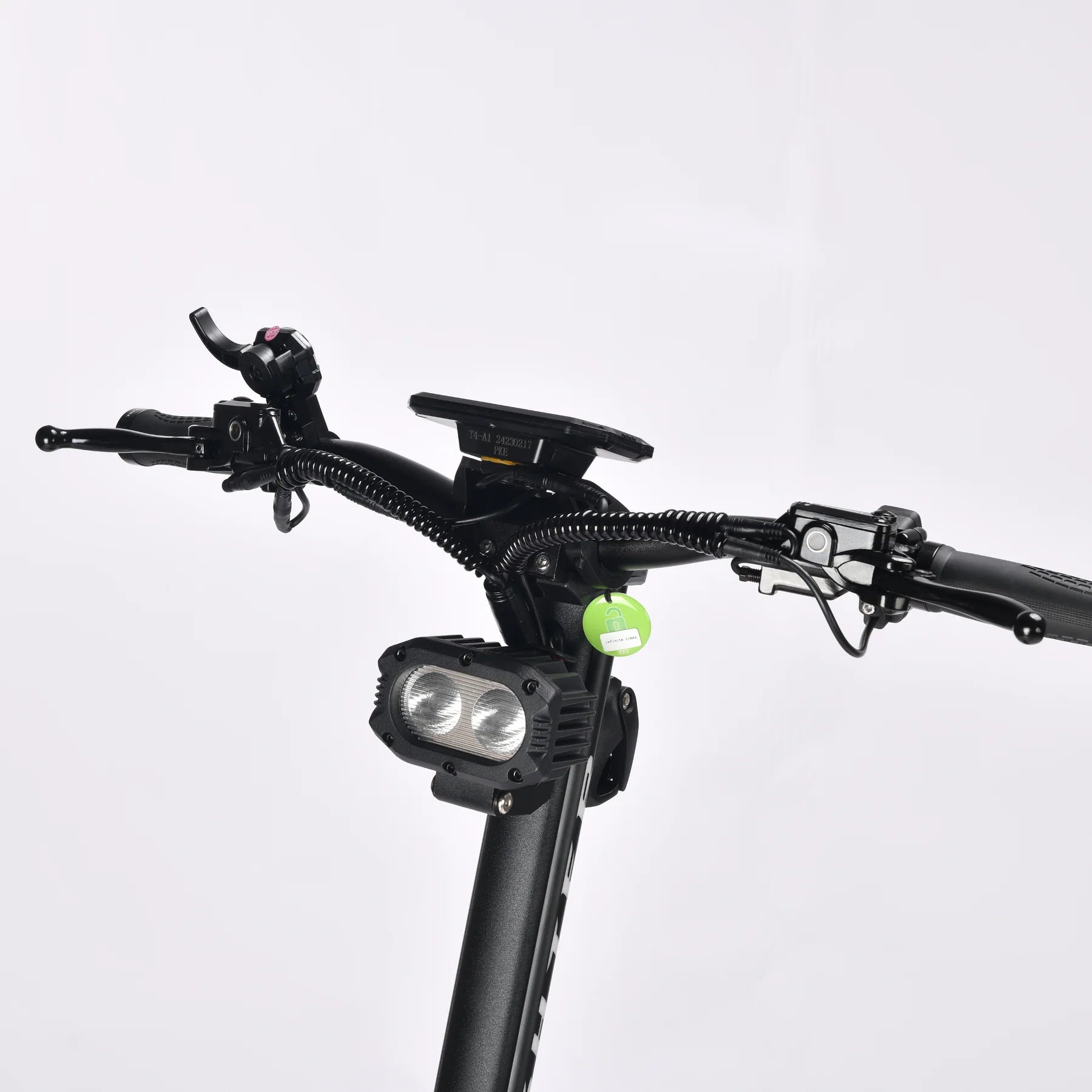 Bicycle handlebar with front light and green reflector on a white background
