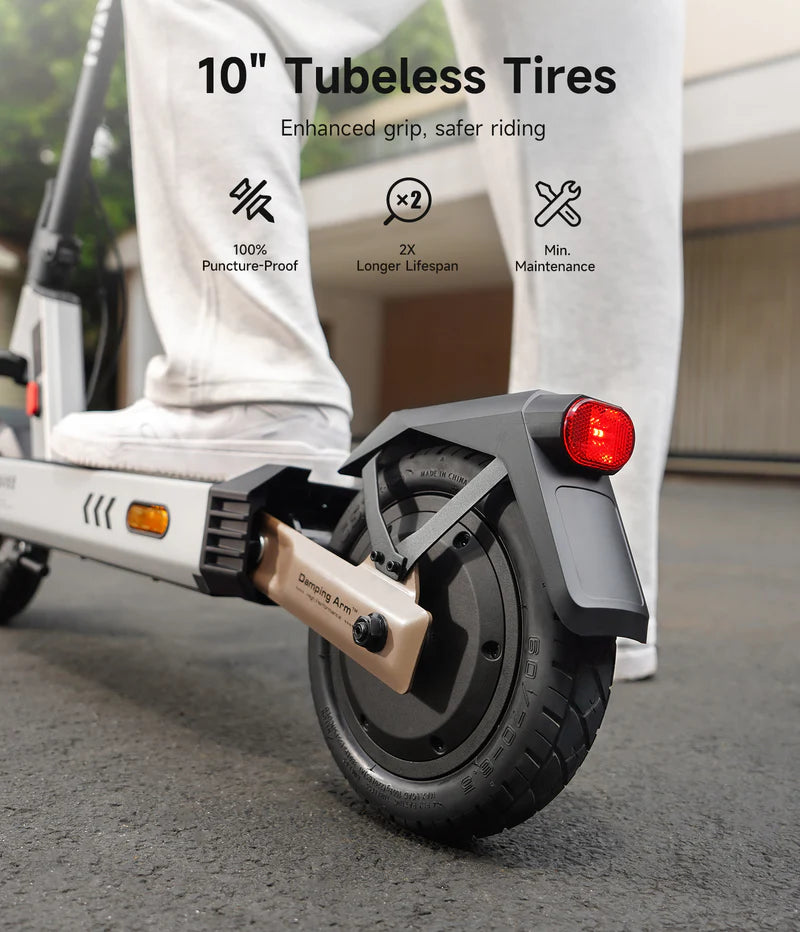 Close-up of an electric scooter with a focus on the 10-inch tubeless tire, highlighting features like enhanced grip and safer riding.