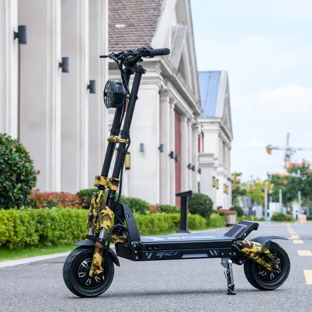 Black electric scooter with camouflage design on a city street.
