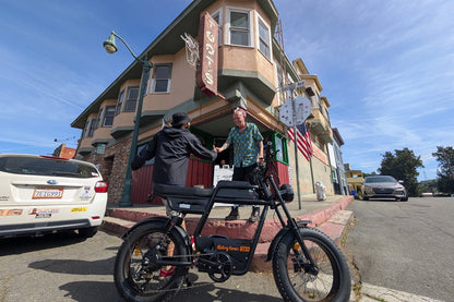 Riding’times GT33 cargo electric bike rider at a suburban intersection