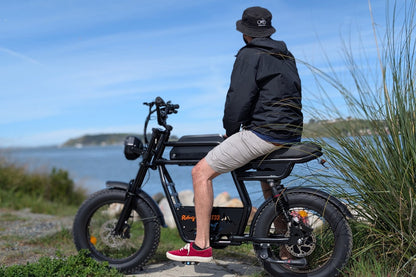 Riding’times GT33 cargo electric bike rider seated by the sea