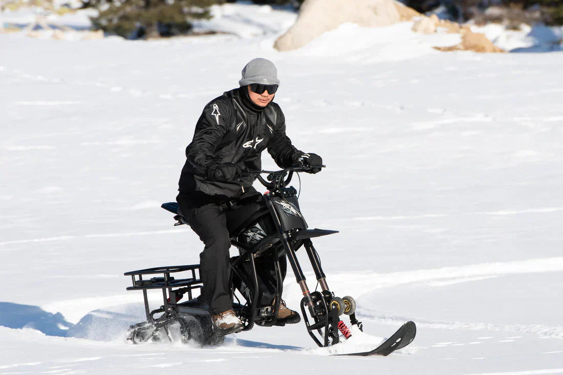 Man ridingGT73 Pro Electric Motorbike on the snow