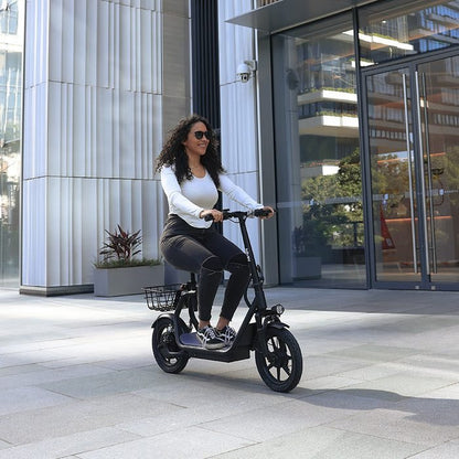 Woman riding an electric scooter in an urban setting
