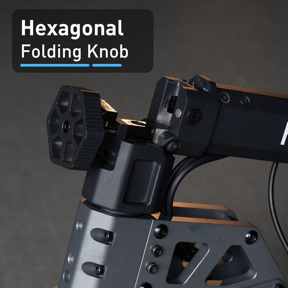 Hexagonal folding knob on a mechanical device with a dark background
