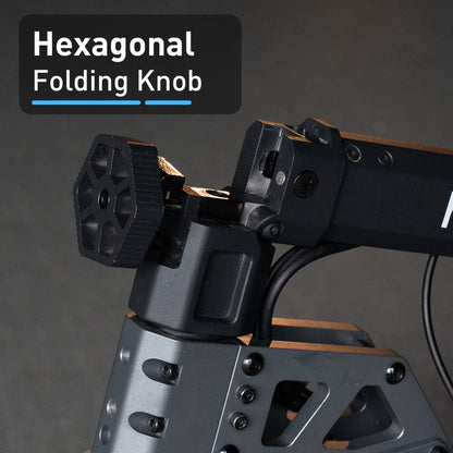 Hexagonal folding knob on a mechanical device with a dark background