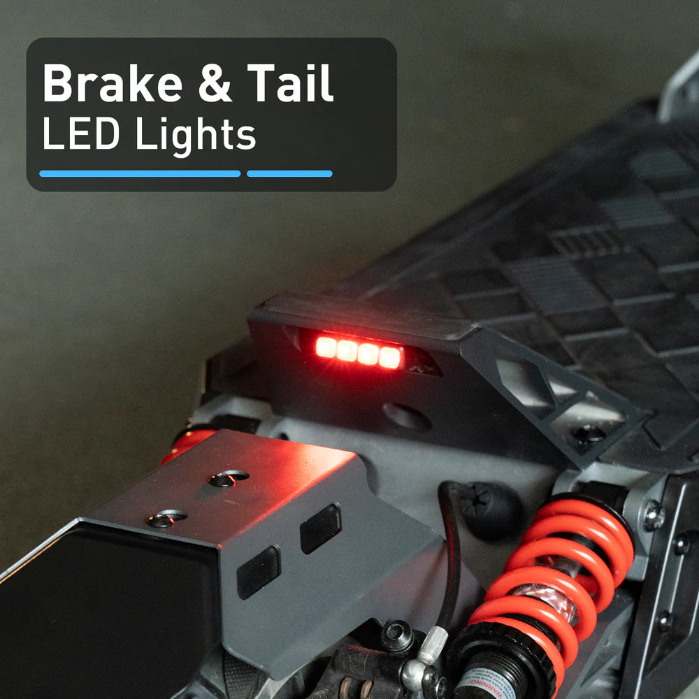 Brake and tail LED lights on a vehicle with a dark background