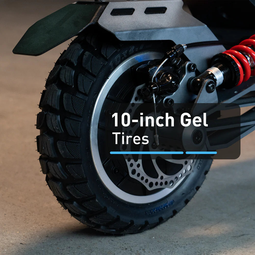 Close-up of a vehicle wheel with 10-inch gel tires on a concrete surface.