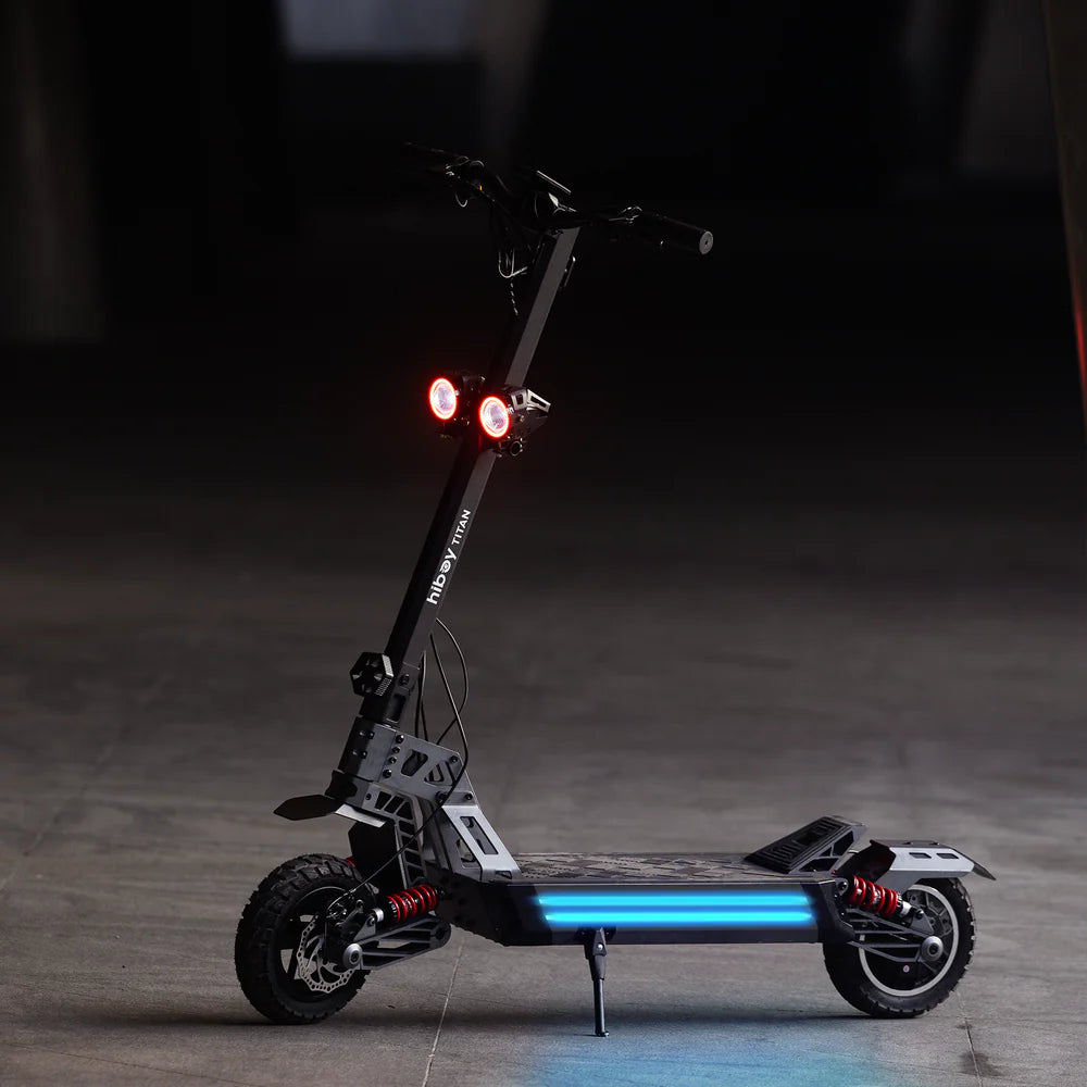Electric scooter with glowing blue lights on a dark background