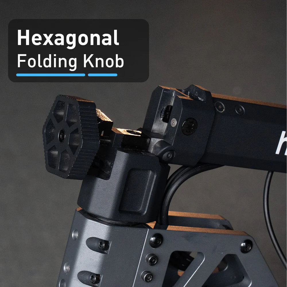 Hexagonal folding knob on a mechanical device with a dark background