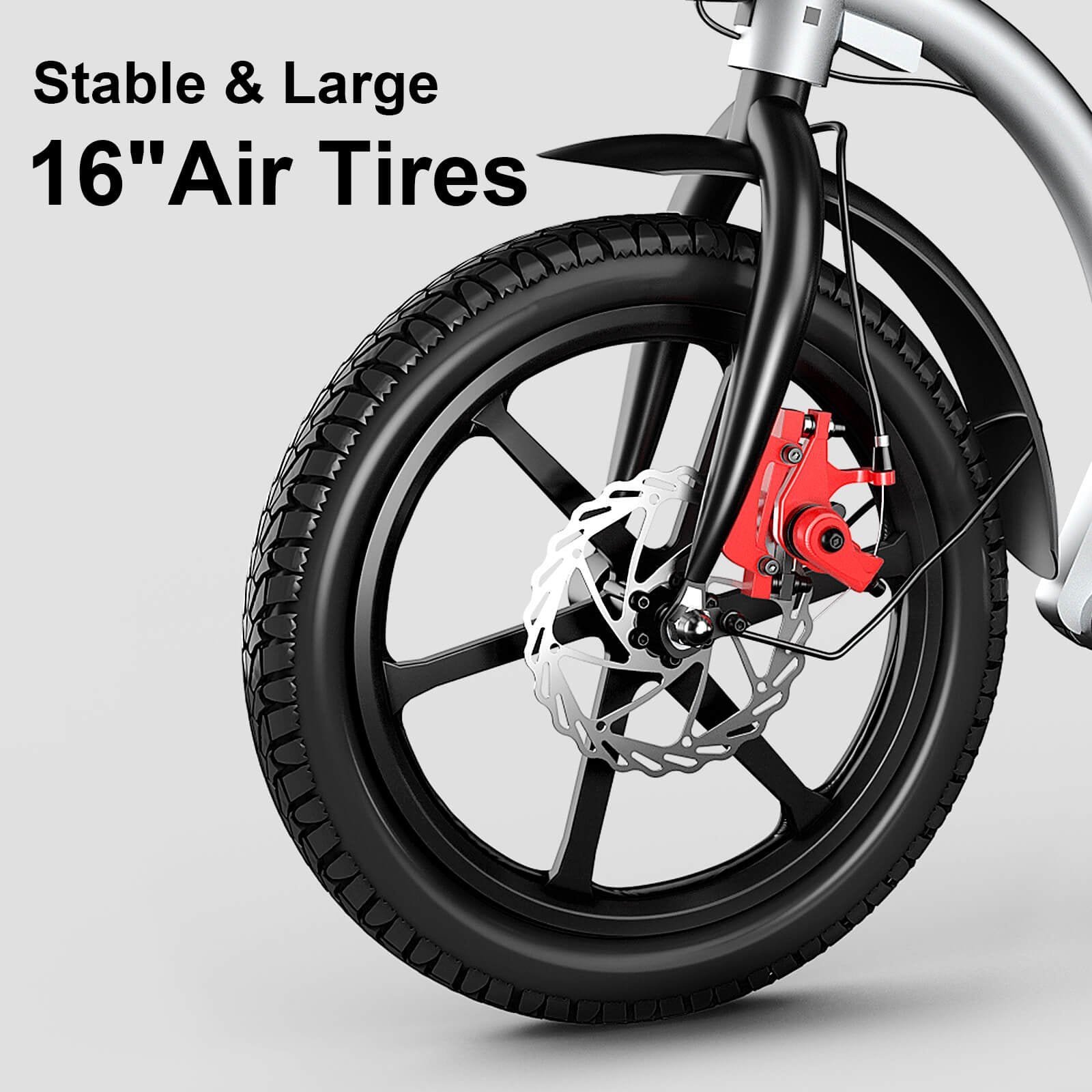 Close-up of a bicycle wheel with large 16-inch air tires on a gray background