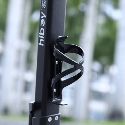 Black bicycle water bottle holder with 'hiboy' branding against a blurred outdoor background