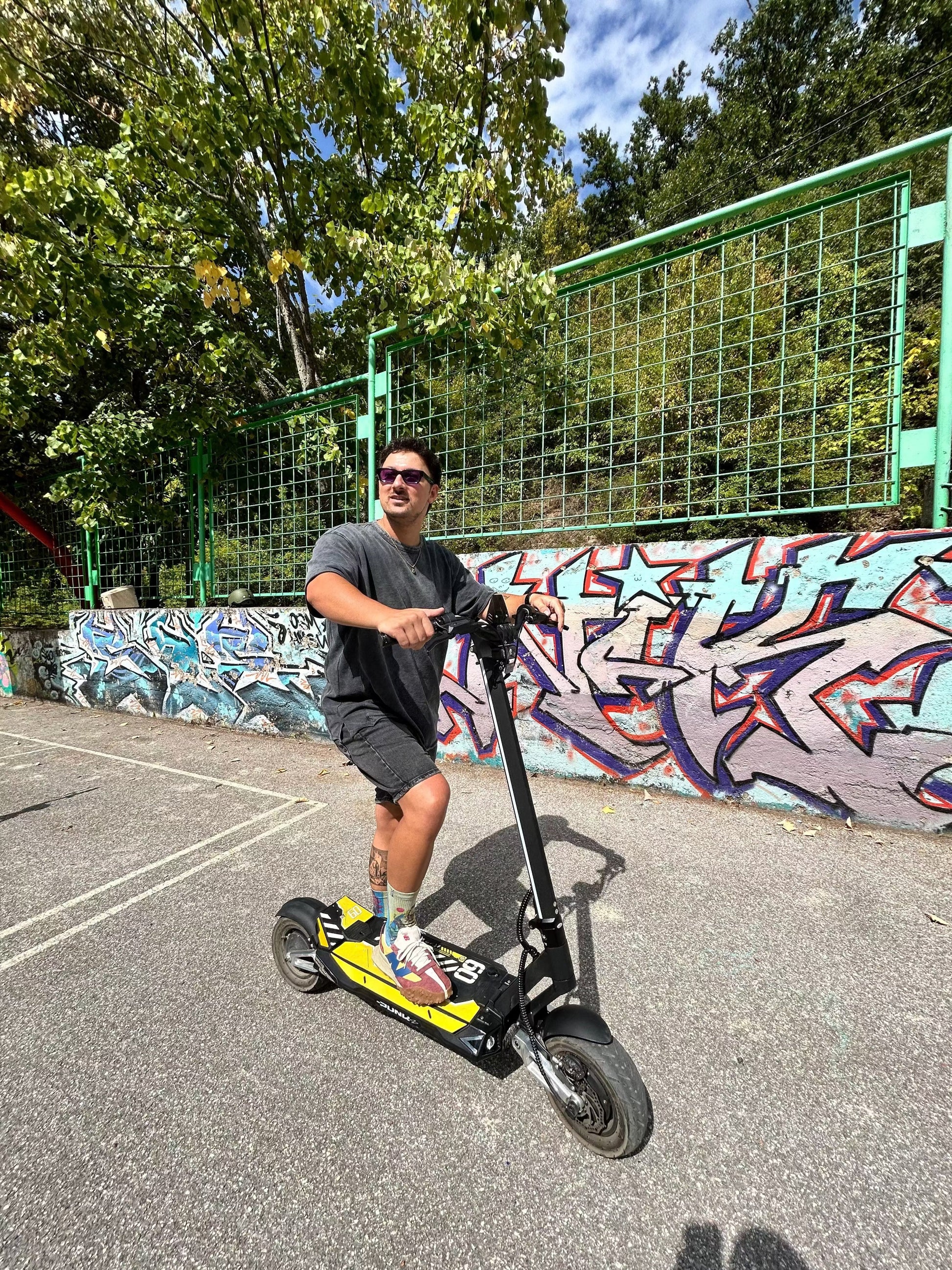 Punk Rebel Electric Scooter with dual motors, hydraulic disc brakes, 84-mile range, and durable tires for powerful commuting
