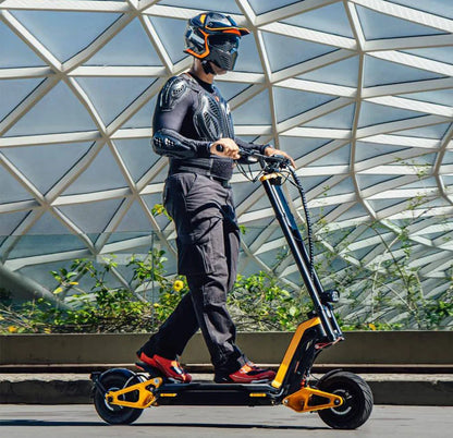 Person riding an electric scooter with a modern architectural background