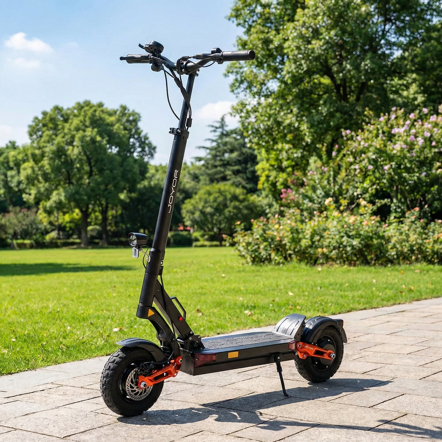 Electric scooter on a paved path with greenery in the background