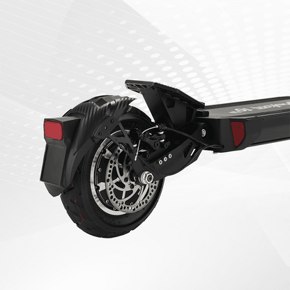 Close-up of a scooter wheel and suspension system on a white background