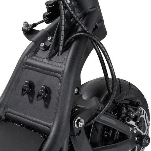Close-up of a black electric bike with visible components on a white background