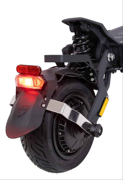 Close-up of a scooter's rear wheel and light on a white background