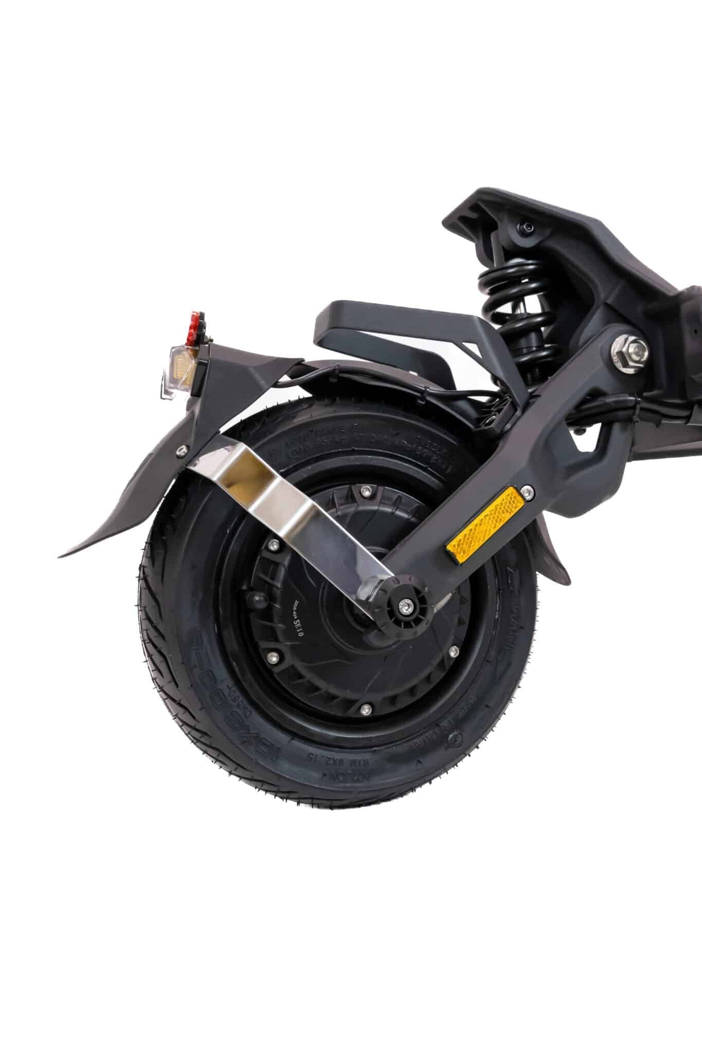 Close-up of a scooter wheel with suspension system on a white background