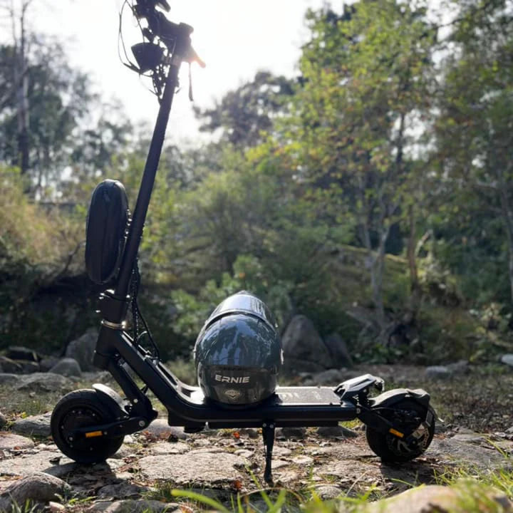 Electric scooter with a helmet on a natural background