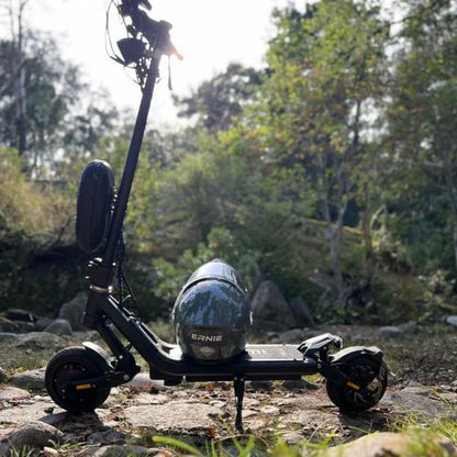 Electric scooter with a helmet on a natural background