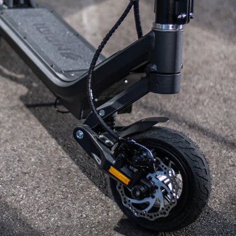 Black electric scooter on a concrete surface