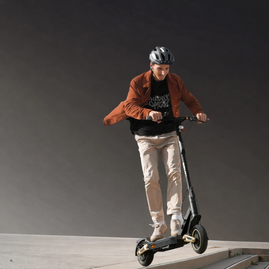 Person riding an electric scooter on a gray background