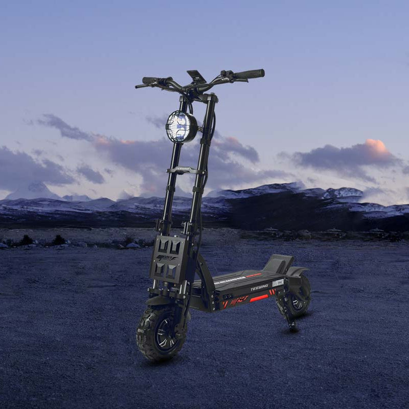 Electric scooter in a desert landscape with mountains in the background