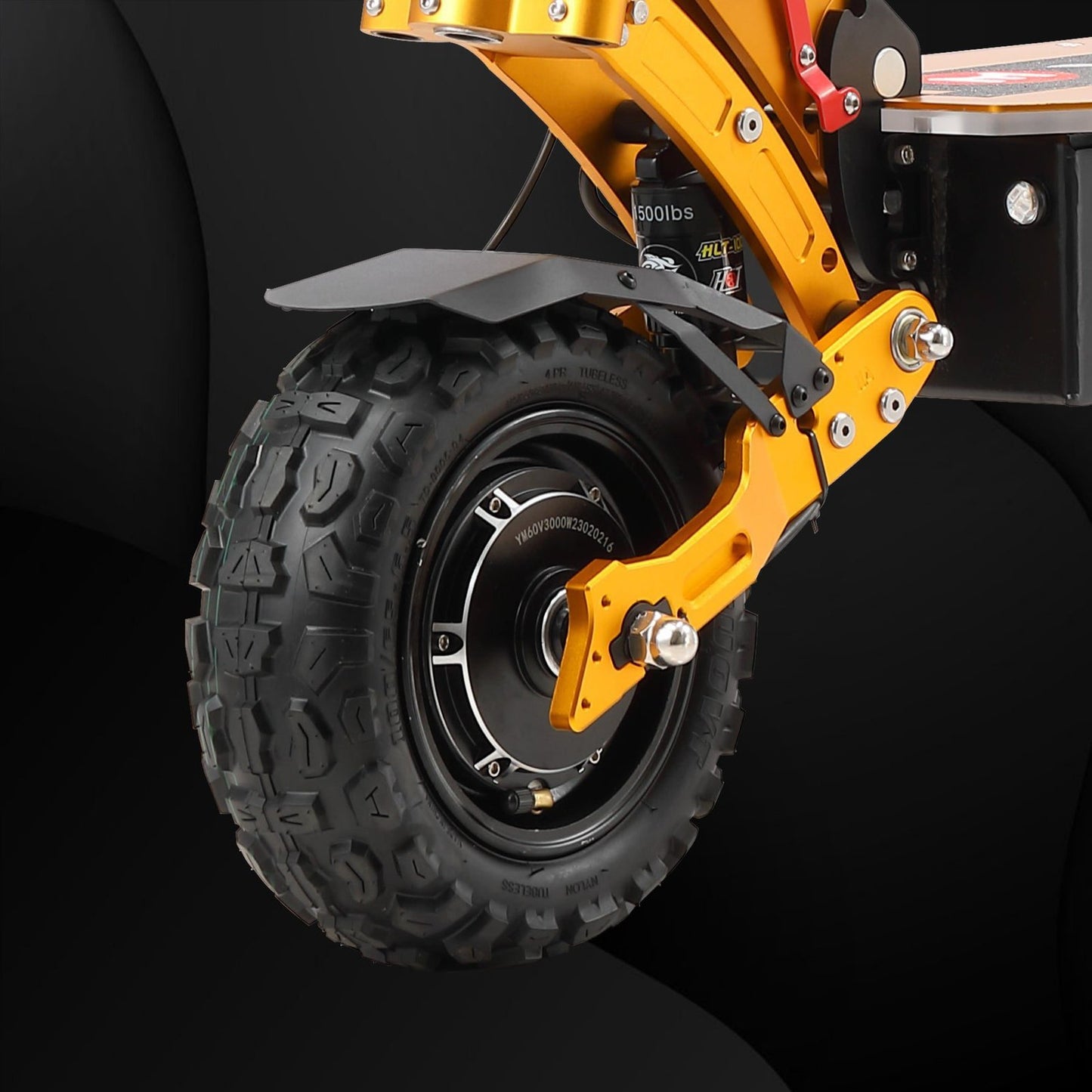 Close-up of a yellow mechanical arm with a black tire on a dark background