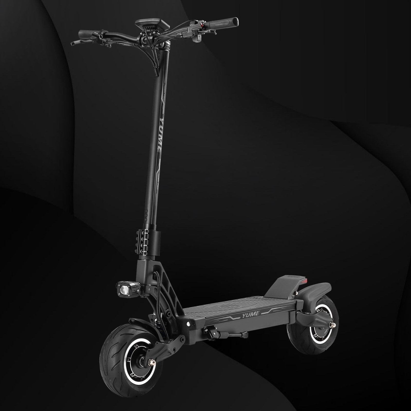 Black electric scooter on a dark background