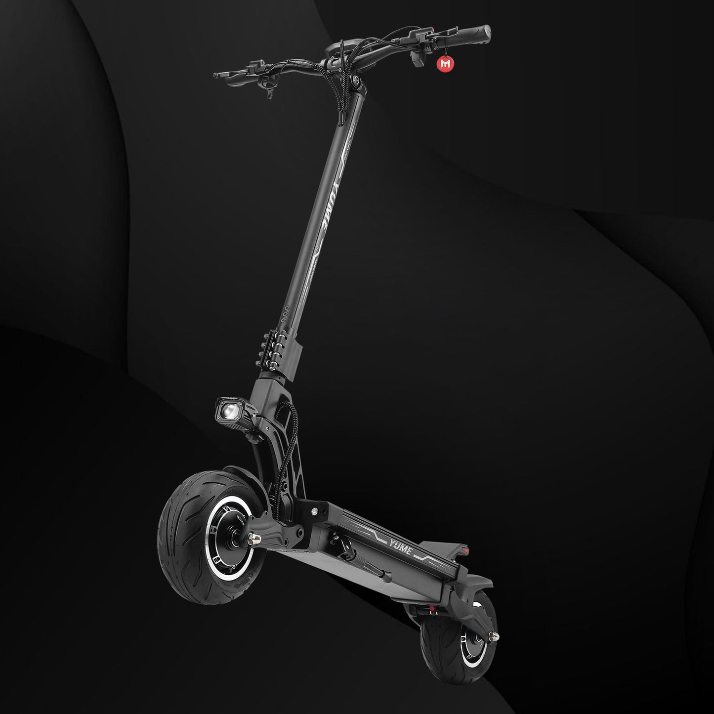 Black electric scooter on a dark background
