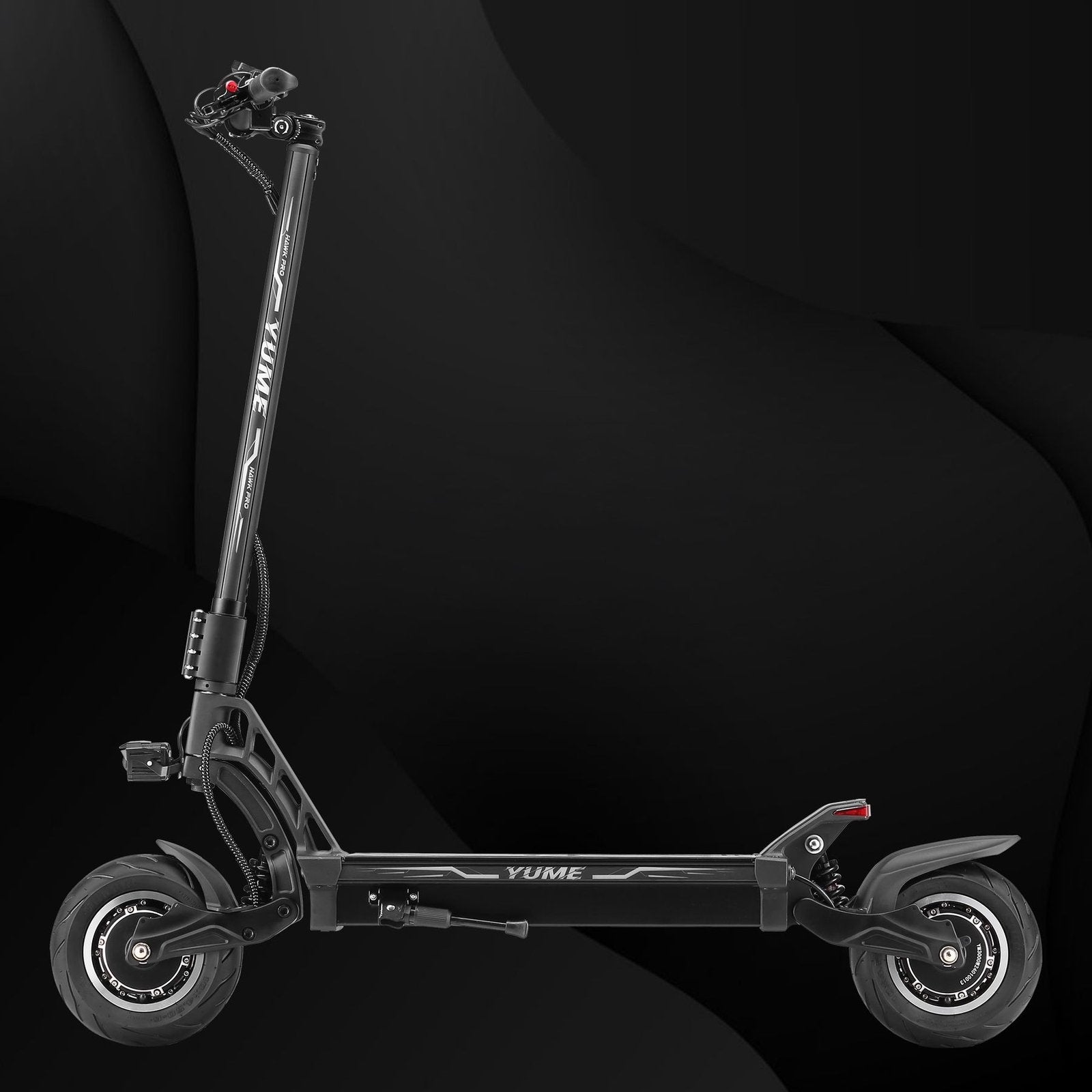 Black electric scooter on a dark background