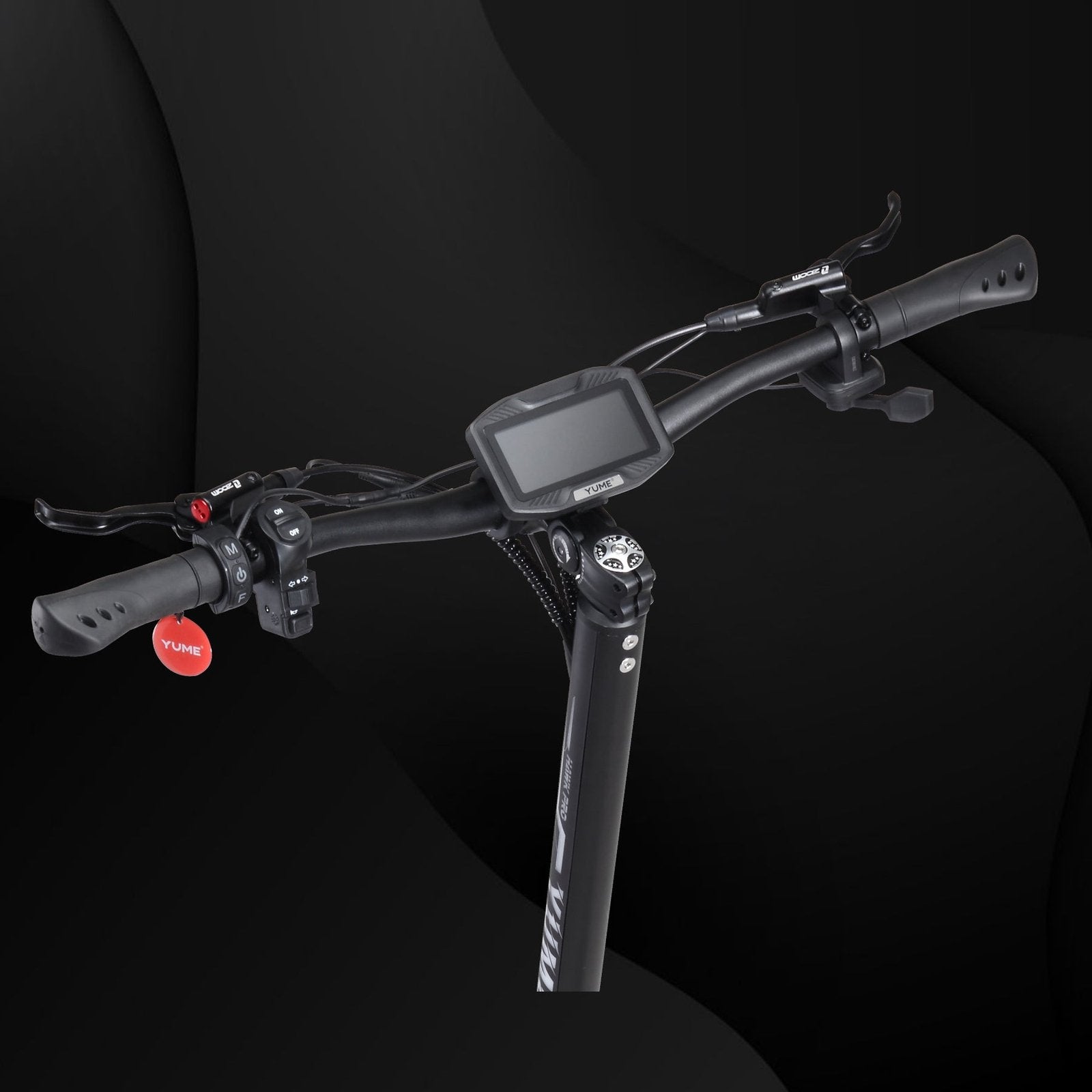 Close-up of bicycle handlebars with a digital display on a black background