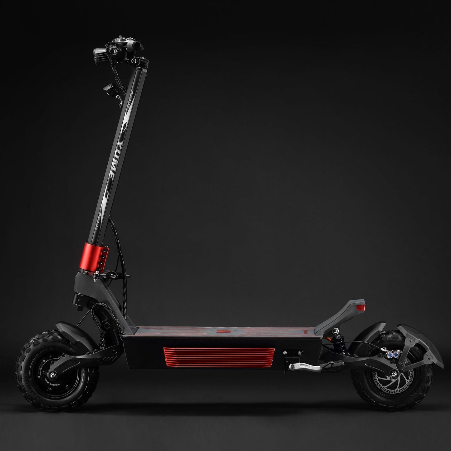 Black electric scooter with red accents on a dark background