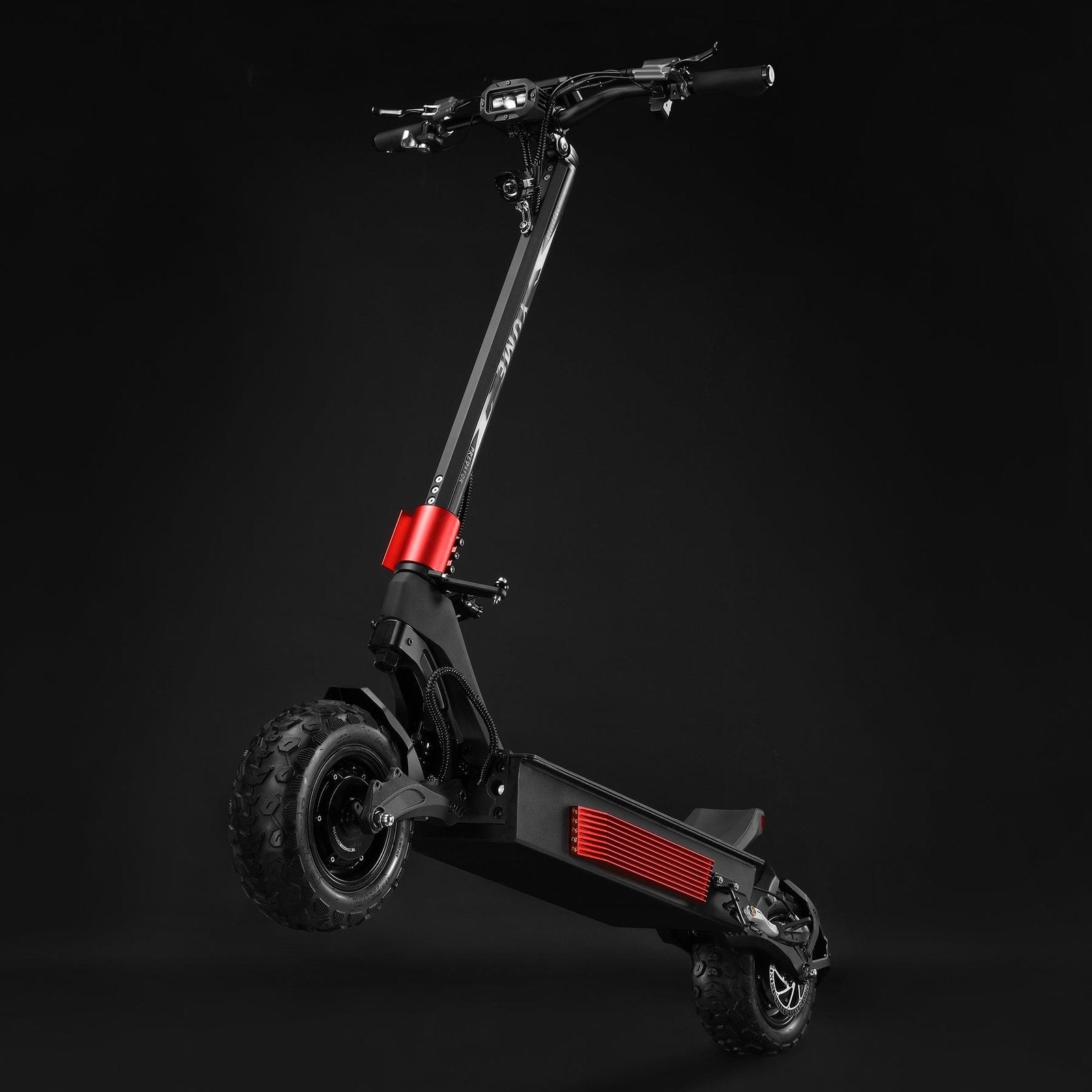 Black electric scooter with red accents on a black background