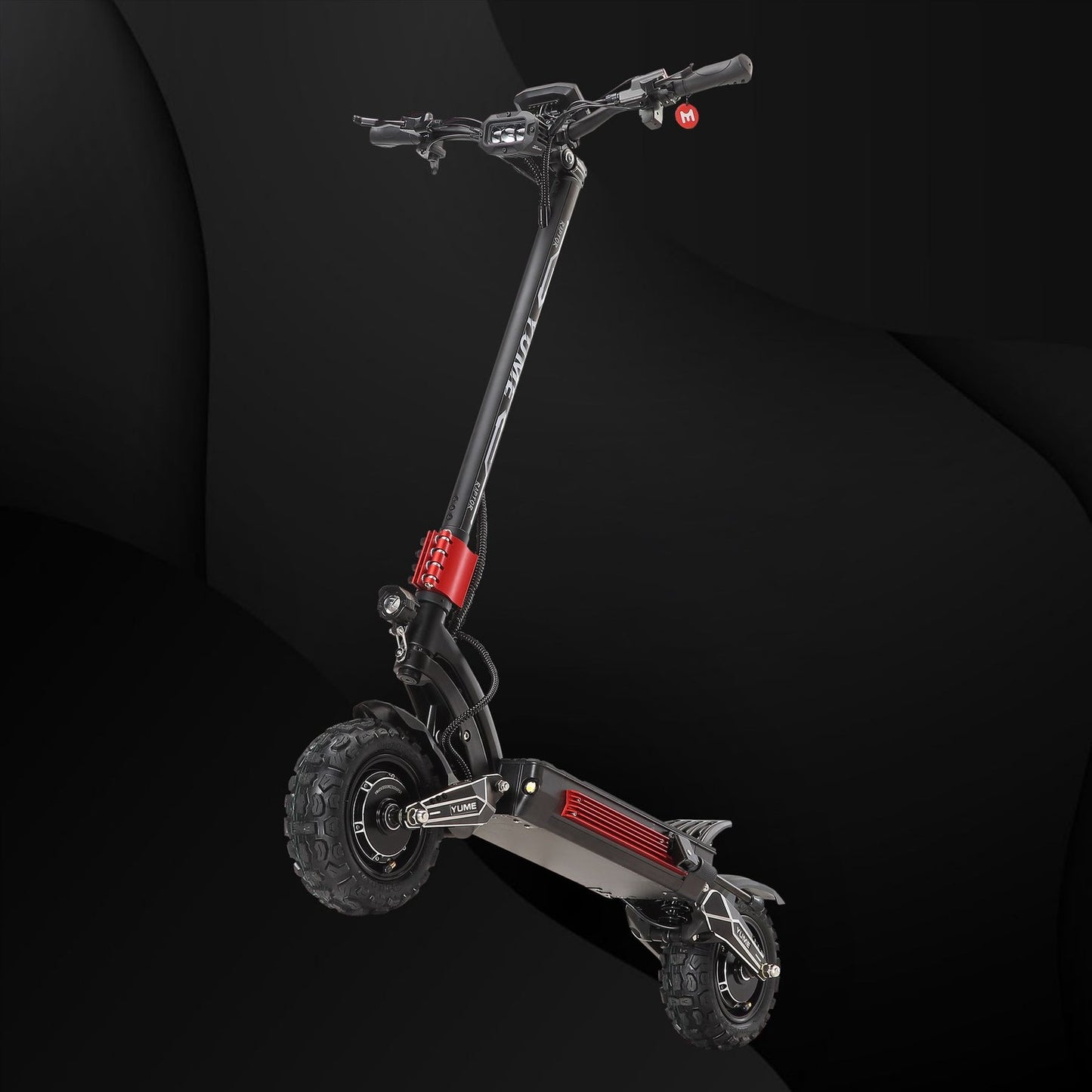 Black electric scooter with red accents on a dark background