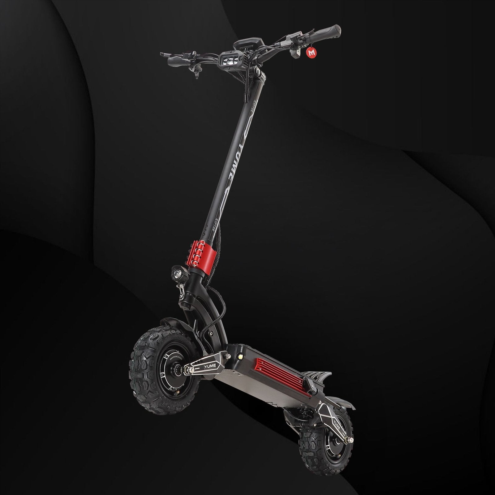 Black electric scooter with red accents on a dark background