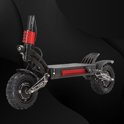 Black electric scooter with red accents on a black background