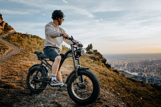 Rider standing with the Riding’times Z8 Pro electric bike on a hilltop above a city