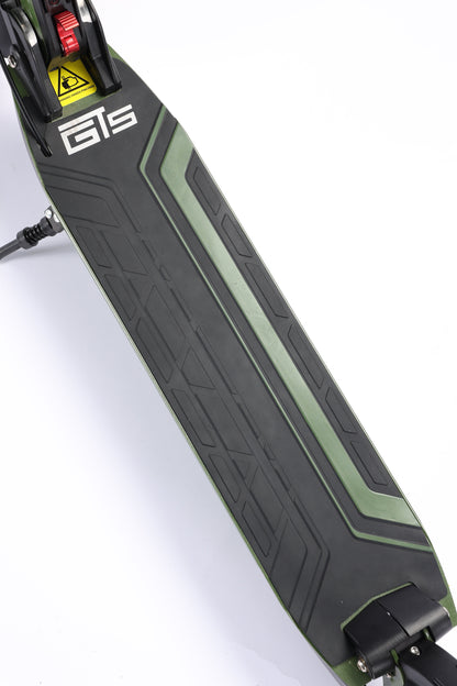 Close-up of a scooter deck with 'GTS' branding on a white background