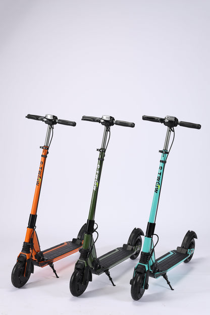 Three folding scooters of different colors on a white background
