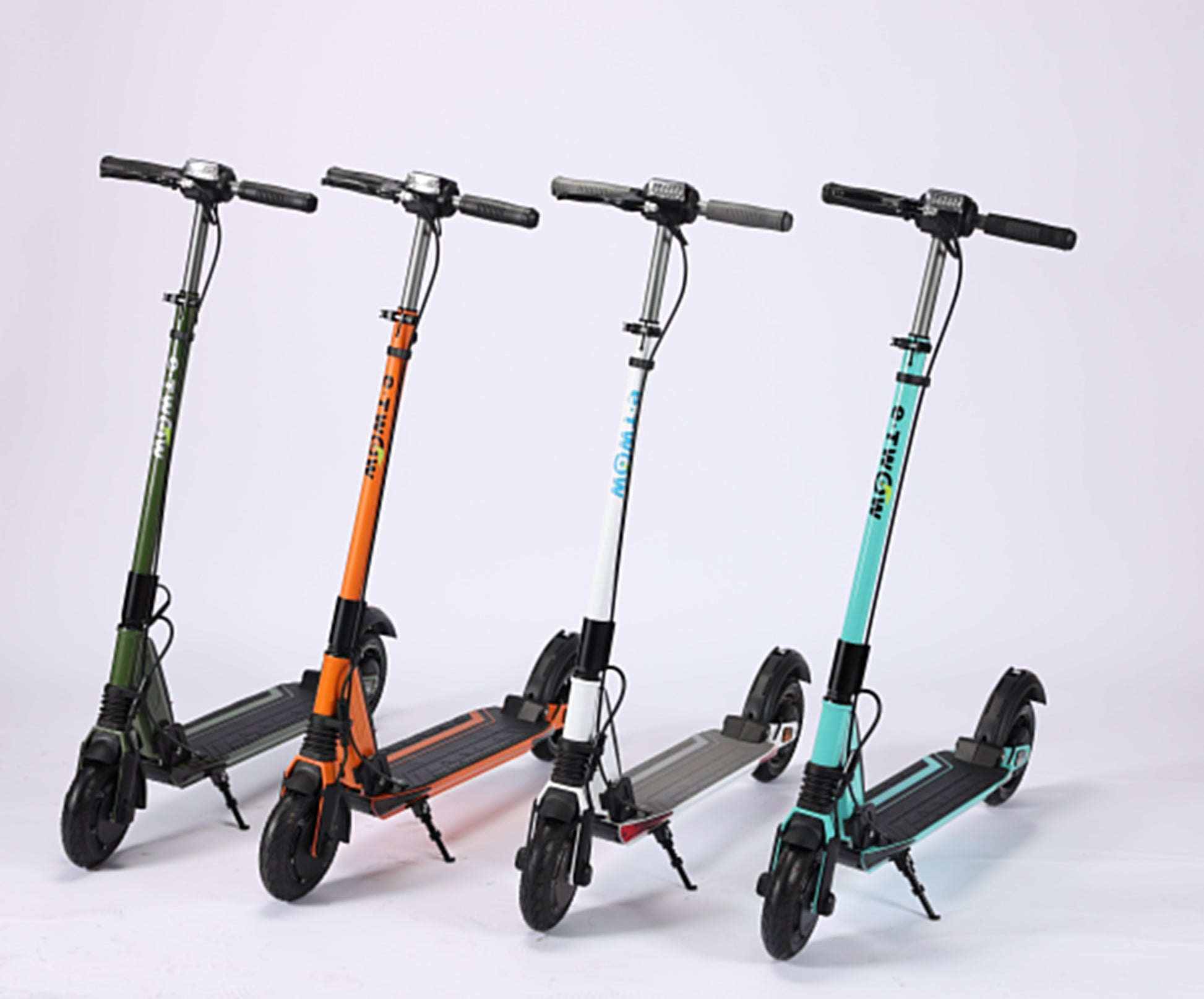 Four electric scooters in different colors on a white background