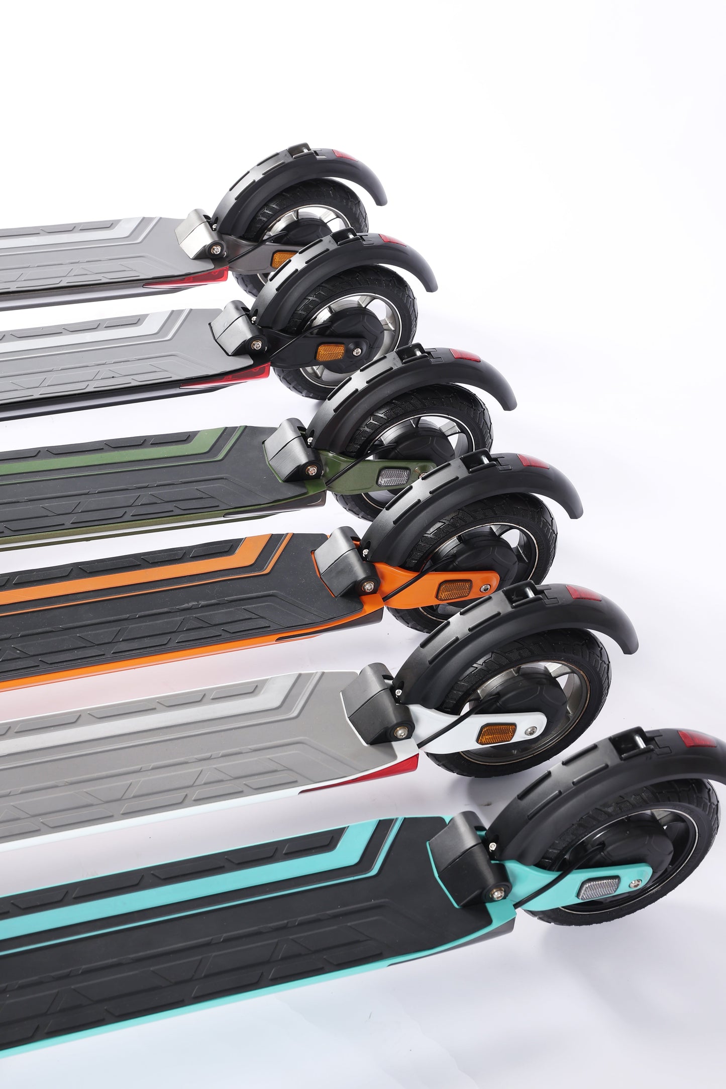 Multiple electric scooters stacked on a white background