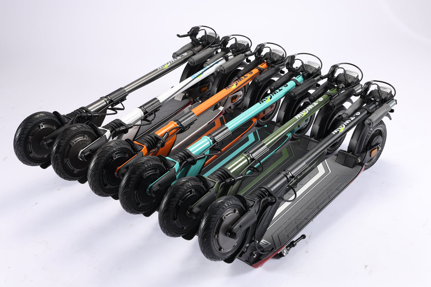 Multiple electric scooters in various colors arranged on a white background
